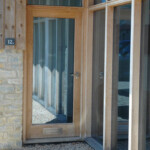 glass-paneled wooden door